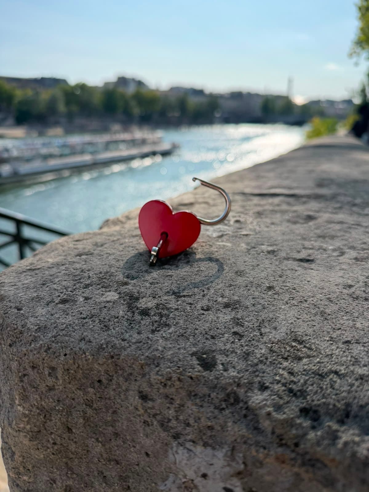 Close-up of the real heart padlock with its little key